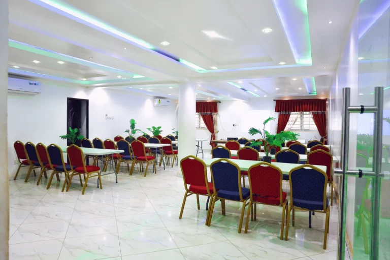 Conference hall arranged in classroom style with banquet seating at Leisure Cozy Hotel, Hohoe