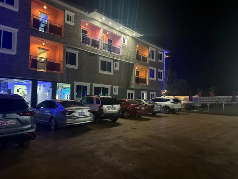 Leisure Cozy Hotel, Hohoe, lit at night with on-site parking