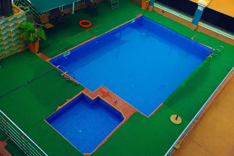 Outdoor swimming pool with separate children’s pool and poolside loungers at Leisure Cozy Hotel, Hohoe